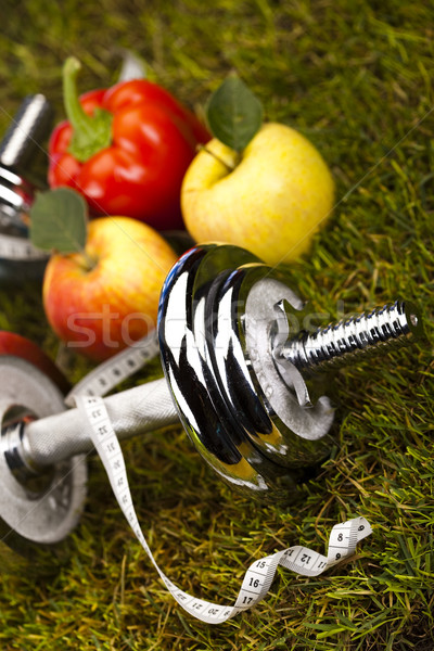 Stock photo: Vitamin and Fitness diet, dumbell in green grass 