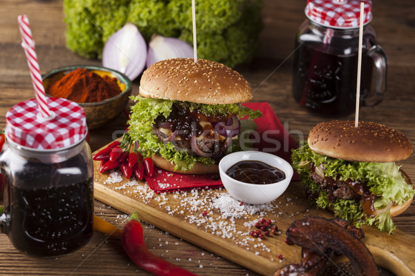 Close-up of home made burgers, wooden desk background Stock photo © JanPietruszka