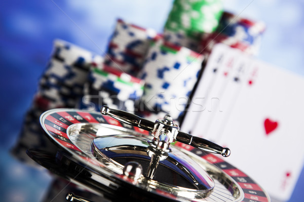 Poker Chips on a gaming with casino roulette Stock photo © JanPietruszka