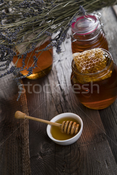 Sweet miel peigne jar en nid d'abeille fond Photo stock © JanPietruszka