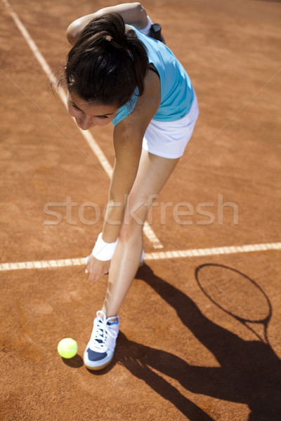 Girl playing tennis on the court Stock photo © JanPietruszka