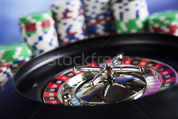 Poker Chips on a gaming with casino roulette Stock photo © JanPietruszka