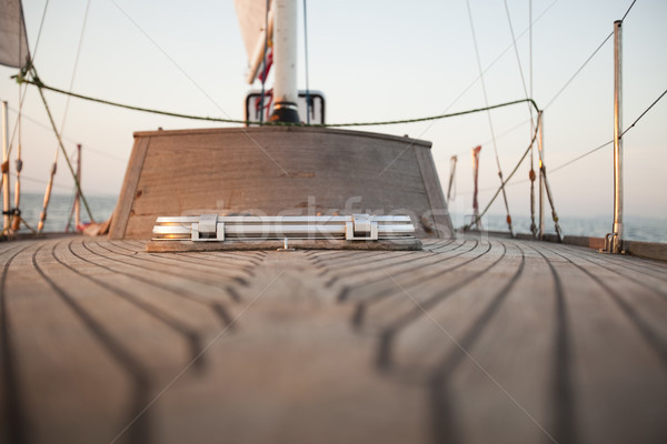 Large winch with line wrapped around and set sail in background Stock photo © JanPietruszka