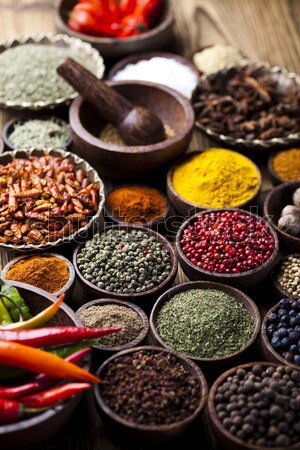 Assortment of spices in wooden bowl background Stock photo © JanPietruszka