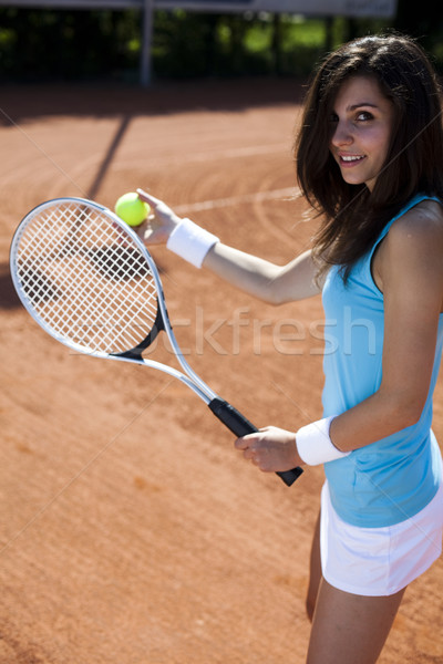 Girl playing tennis on the court Stock photo © JanPietruszka
