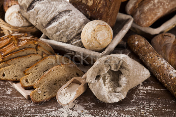 Freshly baked traditional bread on wooden table Stock photo © JanPietruszka