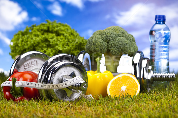 Vitamin and Fitness diet, dumbell in green grass  Stock photo © JanPietruszka