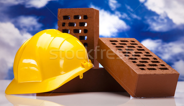 Hard hat with bricks and trowel Stock photo © JanPietruszka