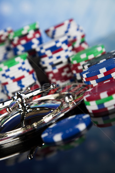 Stock photo: Poker Chips on a gaming with casino roulette