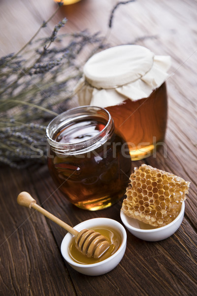 Jar of honey with honeycomb Stock photo © JanPietruszka