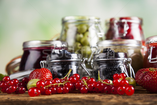 Glass of mixed berry jam with strawberries, bilberries, red curr Stock photo © JanPietruszka