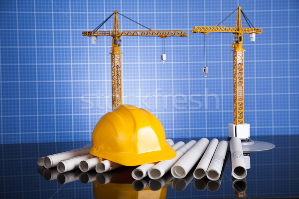 Crane, Safety helmet, Blueprints and construction site Stock photo © JanPietruszka