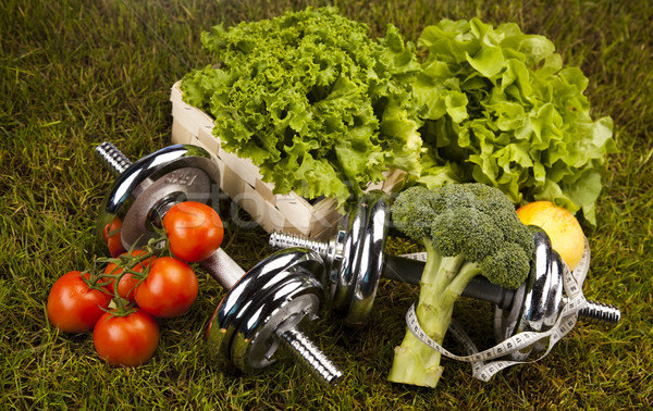 Vitamin and Fitness diet, dumbell in green grass Stock photo © JanPietruszka