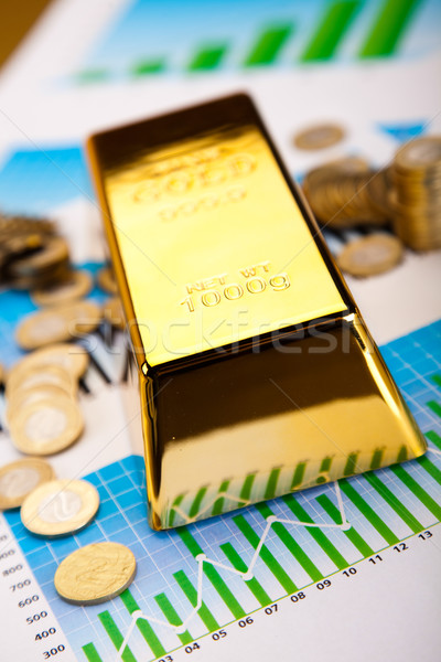 Stock photo: Gold bars with a linear graph, ambient financial concept
