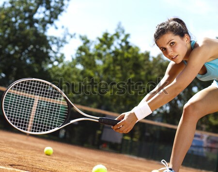 Girl playing tennis on the court Stock photo © JanPietruszka