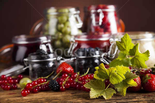 Stock photo: Glass of mixed berry jam with strawberries, bilberries, red curr