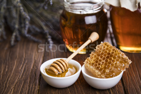 Jar of honey with honeycomb Stock photo © JanPietruszka