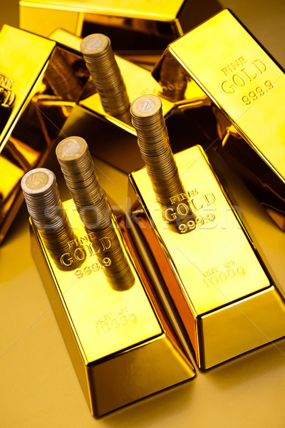 Gold bars and coins, ambient financial concept Stock photo © JanPietruszka