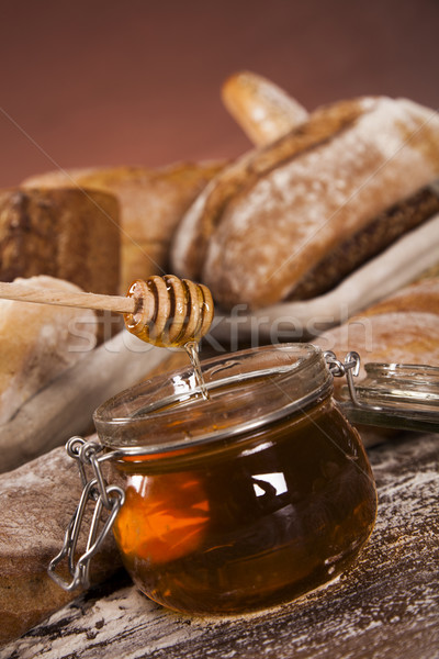 Fresh bread and wheat on the wooden Stock photo © JanPietruszka