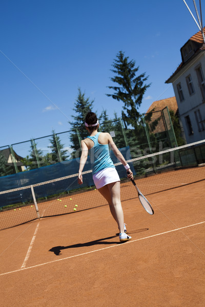 Stock photo: Young woman playing tennis, natural colorful tone