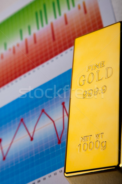 Gold bars with a linear graph, ambient financial concept Stock photo © JanPietruszka