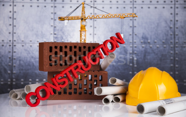Construction plan with a crane and yellow helmet Stock photo © JanPietruszka