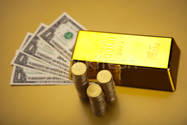 Coins and gold bars, ambient financial concept Stock photo © JanPietruszka