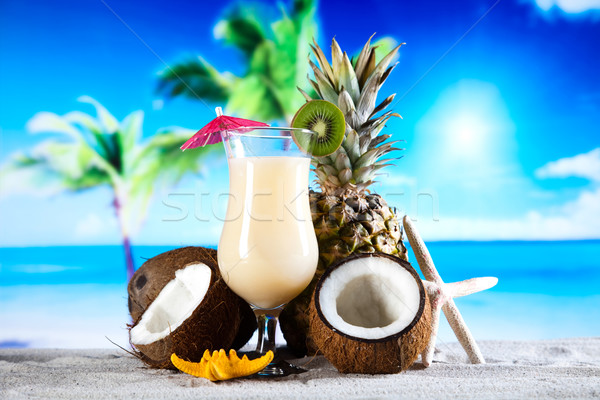 Stock photo: Fruit cocktails on the beach 