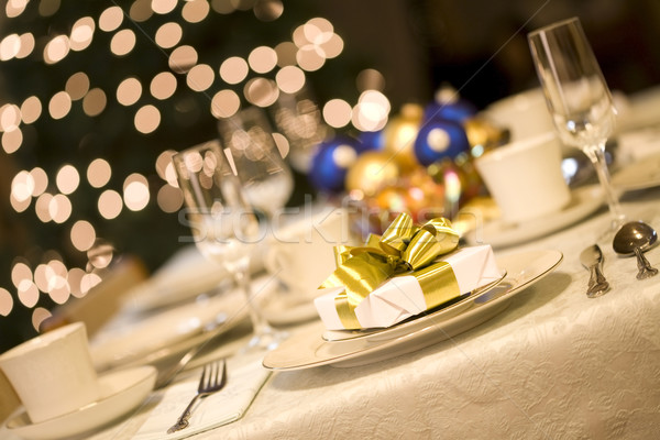 Arany ajándék étkezőasztal karácsonyfa fények sötét Stock fotó © jarenwicklund