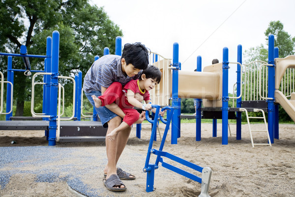 Older brother helping disabled sibling play Stock photo © jarenwicklund