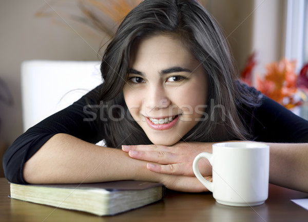 Teenage or young woman at table with Bible and coffee cup Stock photo © jarenwicklund