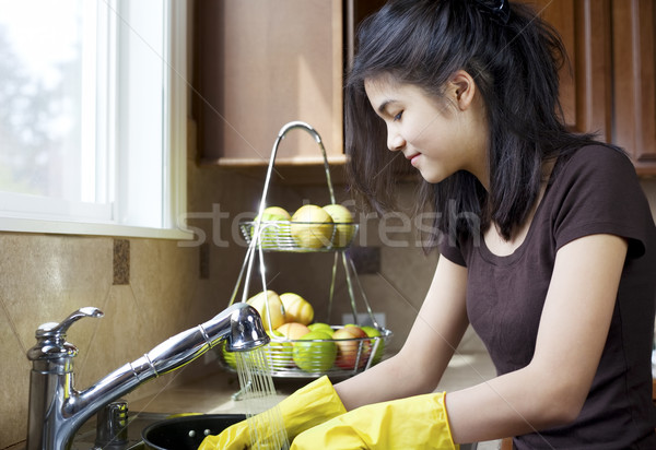 Teen girl washing dishes at kitchen sink Stock photo © jarenwicklund