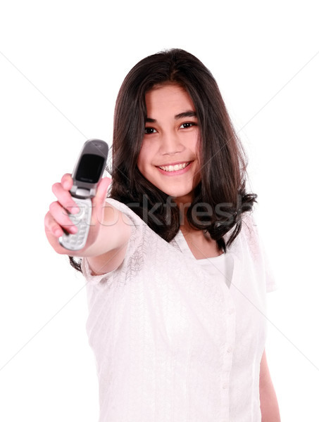 Biracial teen girl holding out cellphone Stock photo © jarenwicklund