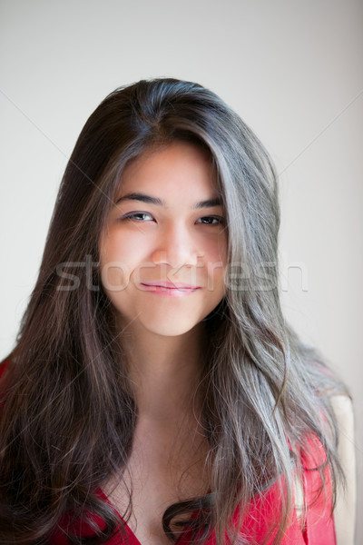 Beautiful biracial teen girl smiling at camera Stock photo © jarenwicklund