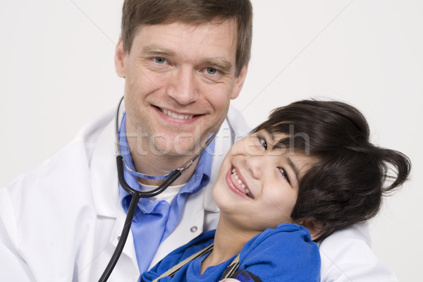 Férfi orvos tart mozgássérült kisgyerek beteg korai Stock fotó © jarenwicklund