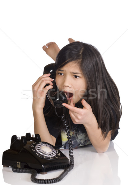 Girl talking on rotary phone, shocked expression Stock photo © jarenwicklund
