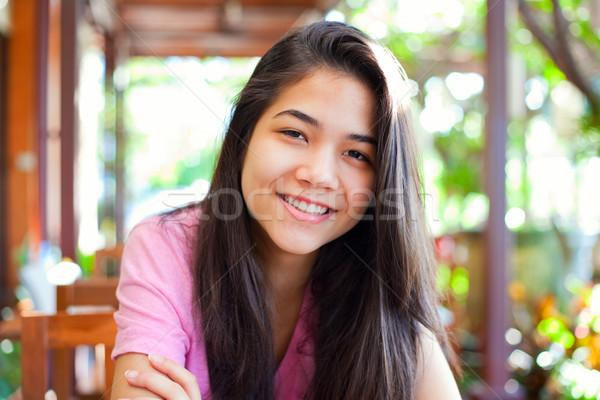 Young teen girl relaxing outdoors on veranda Stock photo © jarenwicklund