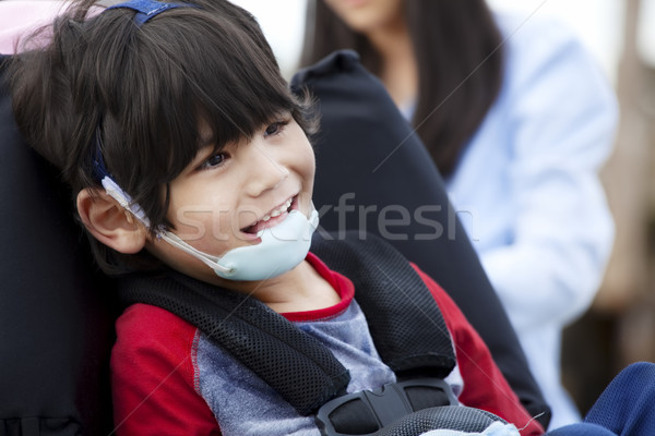 Boldog ötéves mozgássérült fiú tolószék orvosi Stock fotó © jarenwicklund
