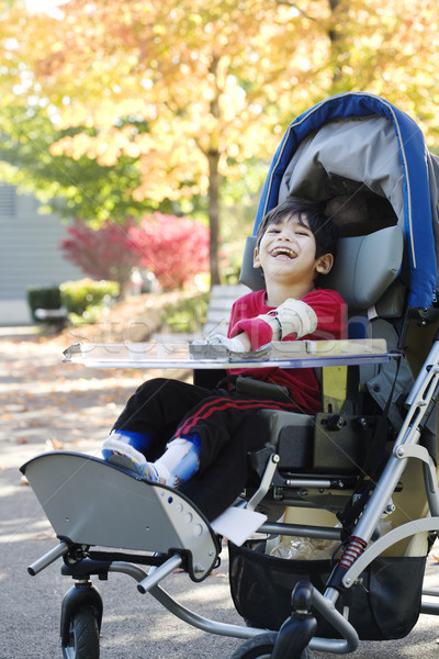 Disabled boy in medical stroller outdoors Stock photo © jarenwicklund