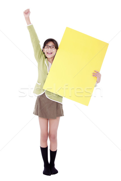 Girl in green sweater holidng blank yellow sign, arm cheering in Stock photo © jarenwicklund