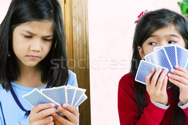 Ragazze carte da gioco uno due guardando bambini Foto d'archivio © jarenwicklund