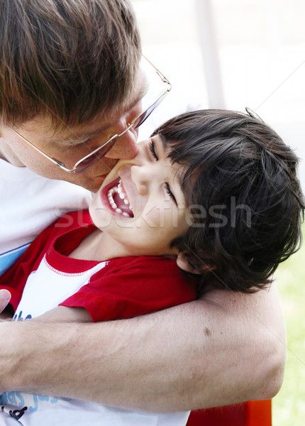 Father kissing his son, three years old Stock photo © jarenwicklund