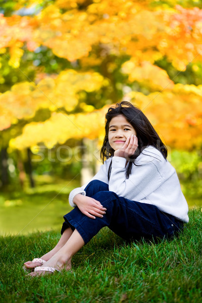 Bambina seduta prato autunno ragazza erba Foto d'archivio © jarenwicklund