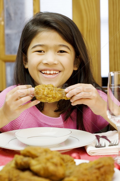 girl eating fried chicken drumstick Stock photo © jarenwicklund