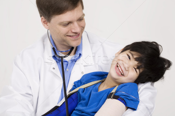 Férfi orvos tart mozgássérült kisgyerek beteg korai Stock fotó © jarenwicklund