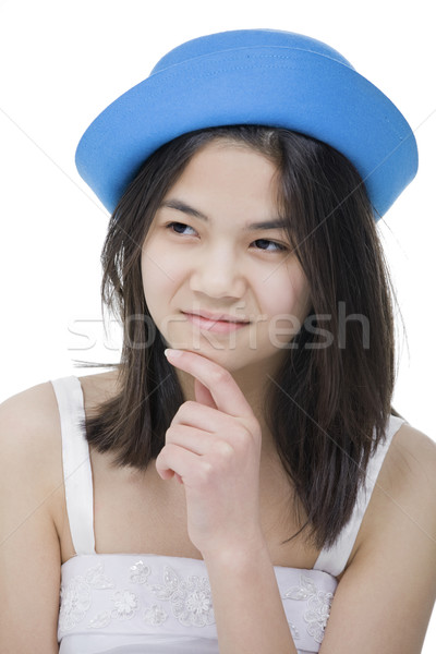 Young teenage girl in blue hat, with wary, doubtful expression.I Stock photo © jarenwicklund