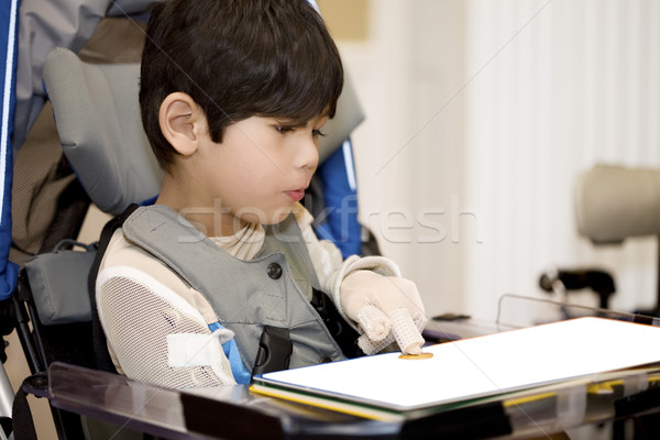 ötéves mozgássérült fiú tanul tolószék könyv Stock fotó © jarenwicklund