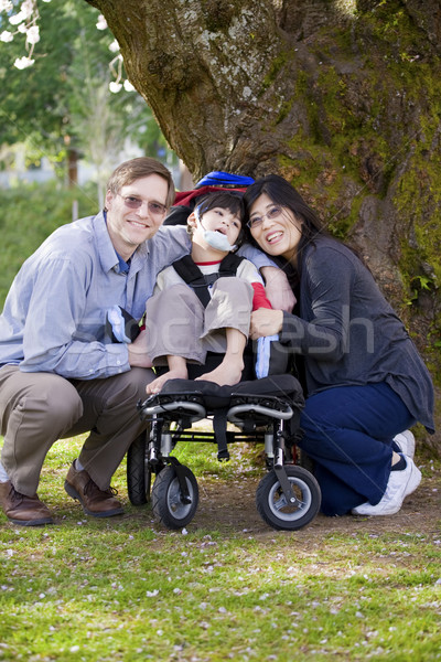 Disabled child surrounded by parents Stock photo © jarenwicklund