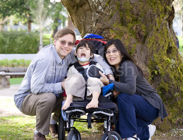Disabled child surrounded by parents Stock photo © jarenwicklund