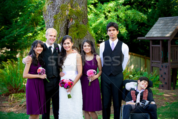 Interracial wedding. Groom standing with his biracial bride's br Stock photo © jarenwicklund